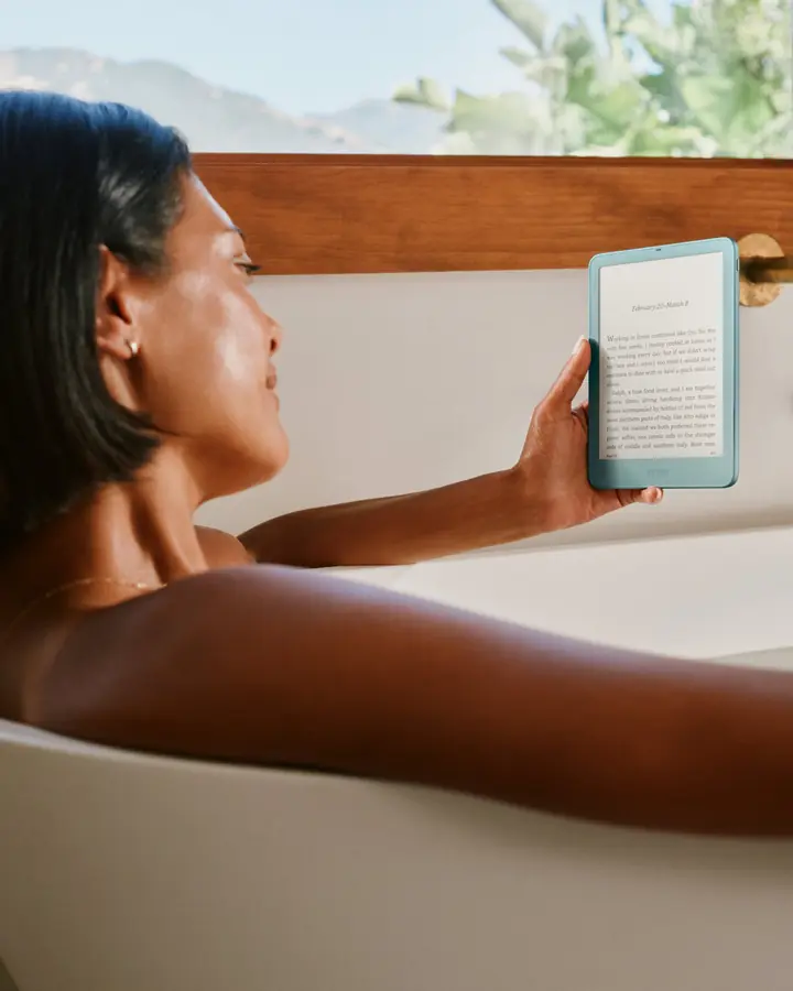 Reading a Kindle in the bath beside a window