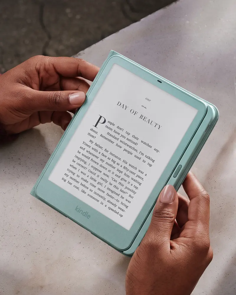 Seaglass green Kindle in a matching cover showing a page of text
